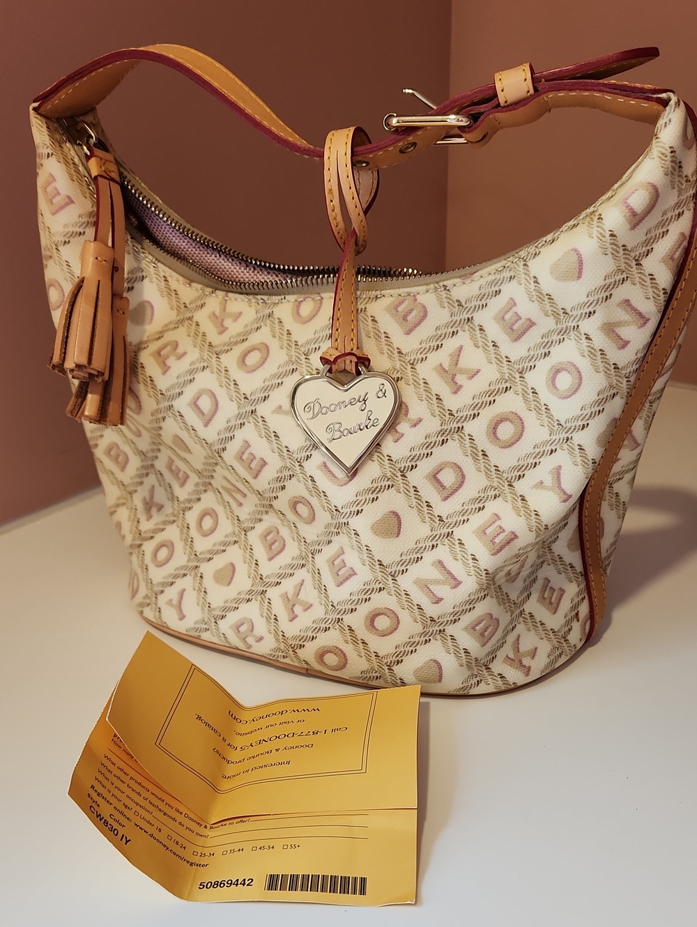 Dooney & Bourke Cream and Pink Monogram Hobo with Tan Trim